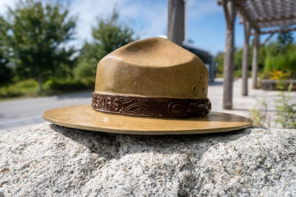 Article Banner - A representation of a National Park Service ranger hat set on a rock.